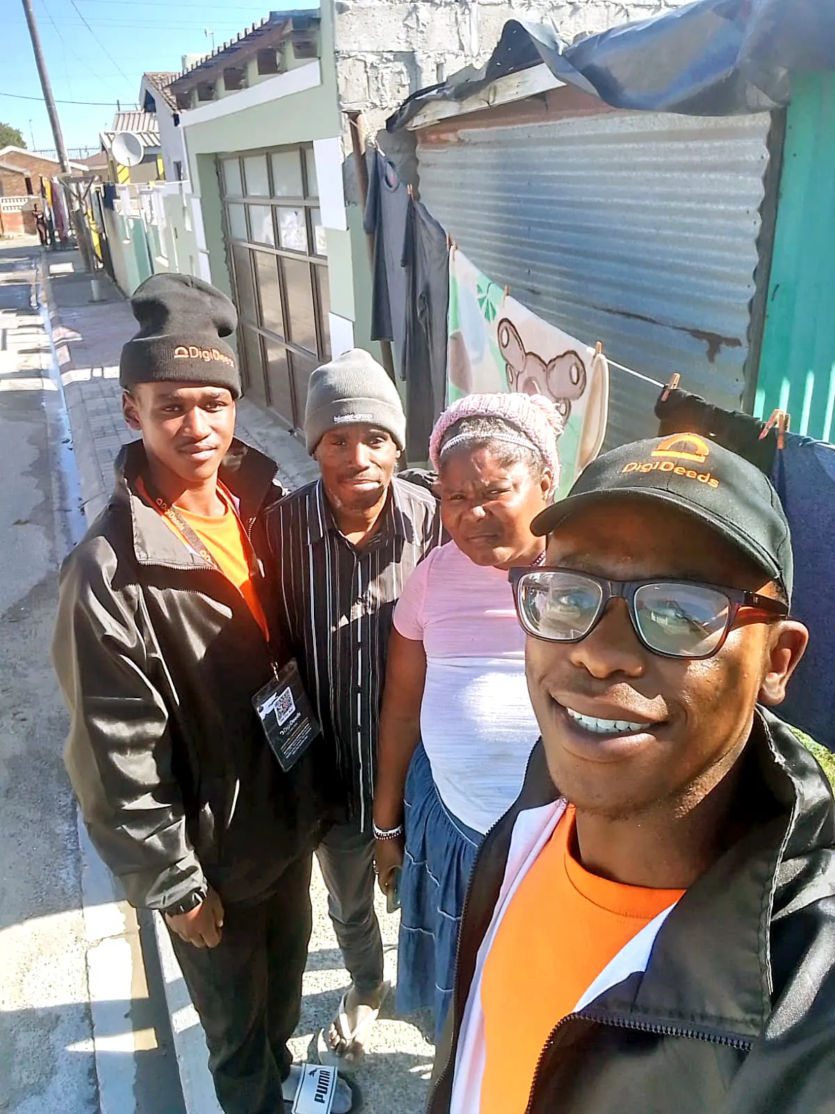 DigiDeeds Activation teams with neighbours in the street outside their homes